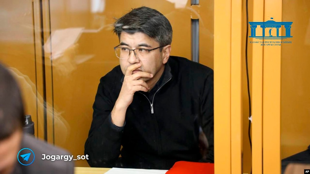 In this photo released by the Kazakhstan Supreme Court Press Office’s Telegram channel on April 12, 2024, businessman Kuandyk Bishimbayev, the country’s former economy minister, sits in a defendants’ cage at his trial in Astana, Kazakhstan.