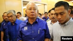 Malaysia's outgoing Prime Minister Najib Razak walks to a news conference to concede the general election in Kuala Lumpur, Malaysia, May 10, 2018.