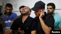 A relative of a Palestinian who was killed during a protest at the Israel-Gaza border fence reacts in Gaza City, Sept. 28, 2018.