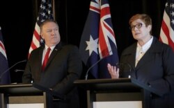 U.S. Secretary of State Mike Pompeo, left, listens as Australian Foreign Minister Marise Payne makes a point during a press conference following annual bilateral talks in Sydney, Australia, Aug. 4, 2019.