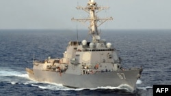 In this 2008 image released by the US Navy, the guided-missile destroyer USS Mason steams through the Atlantic Ocean. The ship responded after a missile fired by Yemen's Iran-backed Houthi rebels struck a Norwegian-flagged tanker off Yemen on Monday, US Central Command said.