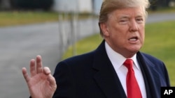 President Donald Trump speaks to reporters on the South Lawn of the White House in Washington, Dec. 4, 2017, before heading to Utah.