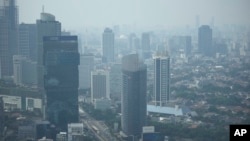 FILE - Haze blankets the main business district in Jakarta, Indonesia on August 11, 2023. (AP Photo/Dita Alangkara, File)