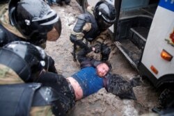 Law enforcement officers detain a protester during a rally in support of jailed Russian opposition leader Alexey Navalny in Moscow, Russia on Jan. 31, 2021. REUTERS/Maxim Shemetov