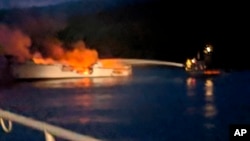 Photo provided by the Santa Barbara County Fire Department shows firefighters working to extinguish a dive boat after a deadly fire broke out aboard the commercial scuba diving vessel off the Southern California Coast, Sept. 2, 2019.