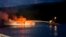 Photo provided by the Santa Barbara County Fire Department shows firefighters working to extinguish a dive boat after a deadly fire broke out aboard the commercial scuba diving vessel off the Southern California Coast, Sept. 2, 2019.