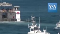 Des migrants tunisiens sont pris en charge par les secours à Lampedusa