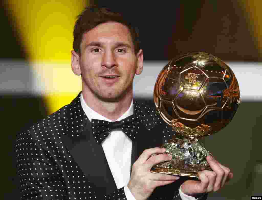 Lionel Messi of Argentina, FIFA World Player of the Year 2012, holds his FIFA Ballon d'Or trophy during the FIFA Ballon d'Or 2012 soccer awards ceremony at the Kongresshaus in Zurich, Switzerland, January 7, 2013. 