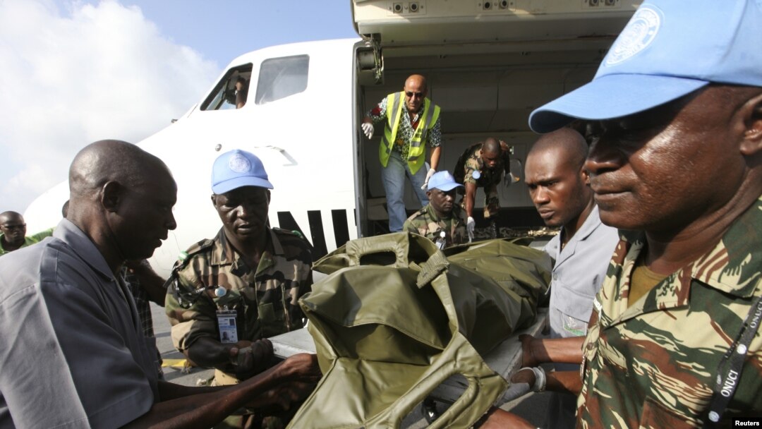 The bodies of the United Nations peacekeepers killed in western Ivory coast near the Liberia border arrive in Abidjan June 9, 2012. 