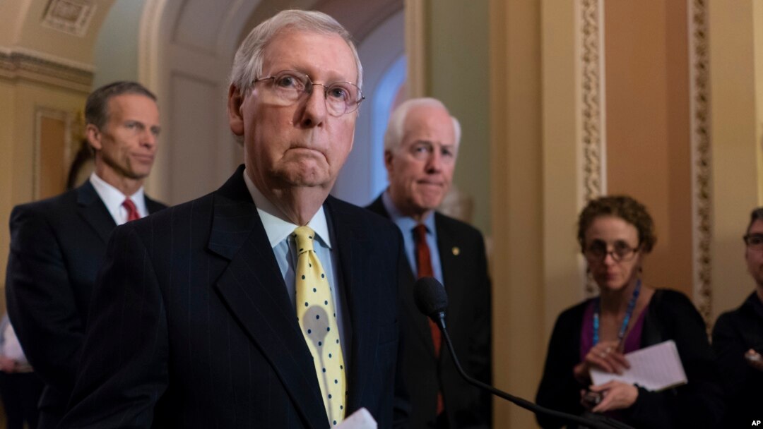 Senate Majority Leader Mitch McConnell, R-Ky., joined from left by Sen. John Thune, R-S.D., and Majority Whip John Cornyn, R-Texas, speaks to reporters on Capitol Hill in Washington, April 17, 2018.