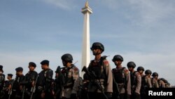 Anti-riot police stand during security preparations ahead of Friday's planned protest by hard-line Muslim groups in Jakarta, Indonesia, Nov. 2, 2016.