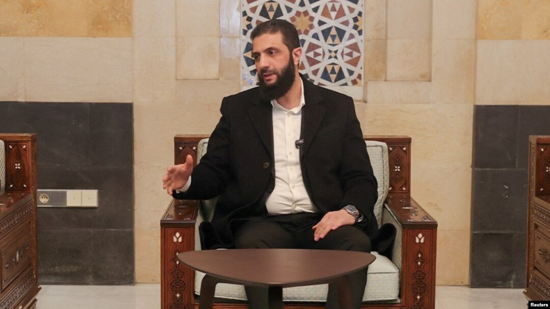 FILE - Syria's de facto leader, Ahmed al-Sharaa, speaks in Damascus in this handout image released Dec. 21, 2024. (Hayat Tahrir Al-Sham/Handout via Reuters)