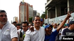 Venezuelan opposition leader Juan Guaido, who many nations have recognised as the country's rightful interim ruler, attends a protest march against Venezuela's President Nicolas Maduro in Caracas, Venezuela, Nov. 16, 2019. 