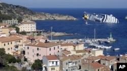 A cruise ship that ran aground is seen off the west coast of Italy at Giglio island, January 14, 2012.