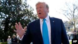 FILE - President Donald Trump speaks to members of the media on the South Lawn of the White House in Washington, before boarding the Marine One helicopter, April 10, 2019.