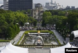 Pelepasan burung merpati pada peringatan Hari Pengeboman Atom ke-79 di Hiroshima, Jepang, di Taman Peringatan Perdamaian Hiroshima, 6 Agustus 2024. (Kyodo/via REUTERS)