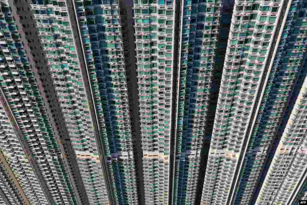 This aerial photo taken on Oct.14, 2024 shows apartment blocks in Tung Chung on Lantau Island in Hong Kong. (Photo by Peter PARKS / AFP)