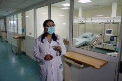 FILE - Wahida Ghalayini, head of the nursing department, speaks to journalists at the quarantine department at Rafik Hariri University Hospital in Beirut, Lebanon, Feb. 22, 2020.