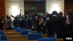 Lawmakers from the opposition MCP walk out of parliament in protest against President Peter Mutharka's legitimacy. (L Masina/VOA)