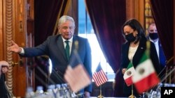 Vice President Kamala Harris and Mexican President Andres Manuel Lopez Obrador arrive for a bilateral meeting on June 8, 2021, at the National Palace in Mexico City.