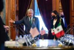 Vice President Kamala Harris and Mexican President Andres Manuel Lopez Obrador arrive for a bilateral meeting on June 8, 2021, at the National Palace in Mexico City.