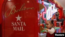 REUTERS Child sending a letter to Santa Clause