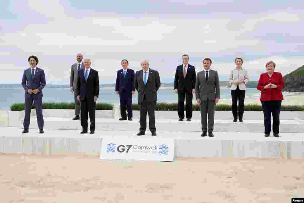 Global leaders pose for a group photo at the G-7 summit, in Carbis Bay, Britain.