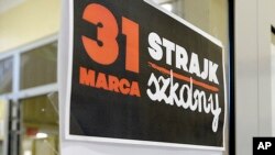 A poster at the door in a school reads: "School Strike March 31" in Warsaw, Poland, on March 31, 2017. 