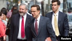 Attorneys Jonathan Blackman (L) and Carmine Boccuzzi (C), lead lawyers representing Argentina in its ongoing debt talks, arrive at federal court for a hearing in New York, August 1, 2014.