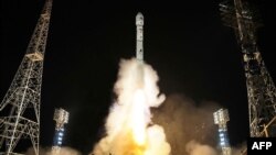 (FILE) This picture released from Korean Central News Agency shows a rocket carrying the reconnaissance satellite 'Malligyong-1.'