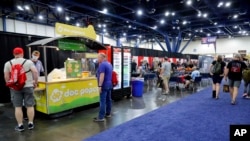 Food vendors and tables occupy the area where Daniel Defense was to have its booth at the National Rifle Association annual meeting in Houston, May 27, 2022. Daniel Defense, maker of the \rifle used in the Uvalde, Texas, shooting, pulled out of the convention after the shooting.