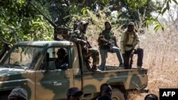 Separatists belonging to the Movement of Democratic Forces of Casamance look on during the release of seven captured Senegalese soldiers at an abandoned settlement, Baipal in Gambia on February 14, 2022. 