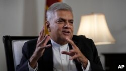 FILE: Sri Lanka's new prime minister Ranil Wickremesinghe gestures during an interview with The Associated Press in Colombo, Sri Lanka, June 11, 2022.
