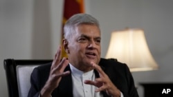 Sri Lanka's new prime minister Ranil Wickremesinghe gestures during an interview with The Associated Press in Colombo, Sri Lanka, June 11, 2022.