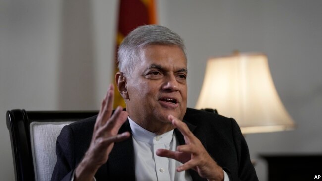 FILE - Sri Lanka's new prime minister Ranil Wickremesinghe gestures during an interview with The Associated Press in Colombo, Sri Lanka, June 11, 2022.