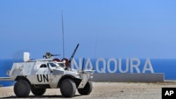 FILE - A United Nations Interim Force In Lebanon (UNIFIL) vehicle patrols in the southern coastal border Lebanese-Israeli town of Naqoura, Lebanon, Monday, June 6, 2022.