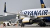 FILE - A Ryanair plane parks at the airport in Weeze, Germany, Sept. 12, 2018. 