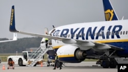 FILE - A Ryanair plane parks at the airport in Weeze, Germany, Sept. 12, 2018. 