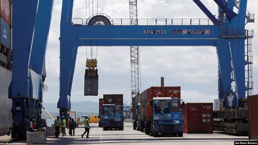 FILE: A crane loads shipping containers on a ship in the port of Mombasa, Kenya, on Oct. 23, 2019. 