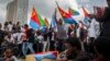 FILE - Eritrean refugees and dissidents, some holding Eritrean flags, demonstrate against human rights abuses allegedly committed by Eritrea's government, outside the headquarters of the African Union in Addis Ababa, Ethiopia, June 23, 2016.