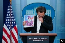 Actor Matthew McConaughe reacts as he holds an image of Alithia Ramirez, 10, who was killed in the mass shooting at an elementary school in Uvalde, Texas, as he speaks during a press briefing at the White House, June 7, 2022, in Washington. (AP Photo/Evan Vucci)