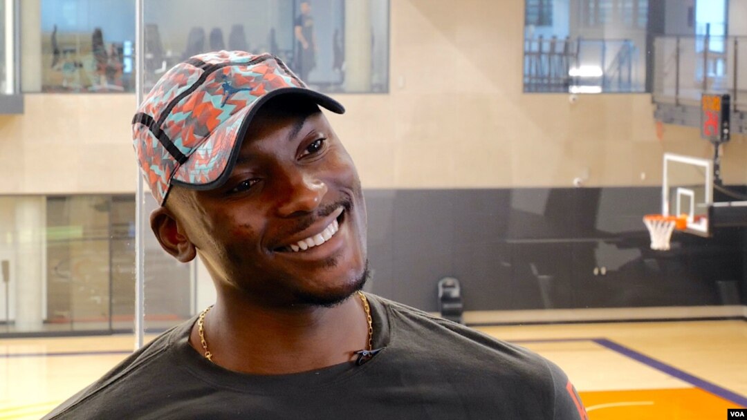 NBA player Bismack Biyombo supports education and public health efforts in the Democratic Republic of Congo, his home country. He’s shown at the Phoenix Suns’ practice facility. (Betty Ayoub/VOA) 