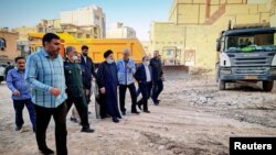 FILE - Iranian President Ebrahim Raisi visits the site where a ten-storey building collapsed in Abadan, Iran June 3, 2022. President Website/WANA/Handout via Reuters)