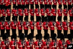 Members of the Household division take part in the Trooping the Colour parade at Horse Guards, in London, Thursday, June 2022. (AP Photo/Matt Dunham)