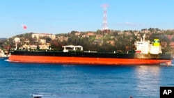FILE: The Greek-flagged oil tanker Prudent Warrior, background, is seen as it sails past Istanbul, Turkey, April 19, 2019.