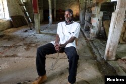 Rodney Stotts, one of the few US Black master falconers, spoke with Reuters in a barn in Maryland, May 10, 2022. (REUTERS/Kevin Fogarty)