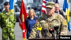 Chairman of the U.S. Joint Chiefs of Staff, General Mark Milley. speaks during a news conference, also attended by Swedish officials, aboard the American amphibious warship USS Kearsarge, ahead of the Baltic Operations 'BALTOPS 22' exercise, in Stockholm, June 4, 2022.