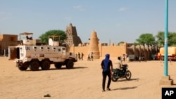 FILE - United Nation forces patrol the streets of Timbuktu, Mali, Sunday, Sept. 26, 2021. 