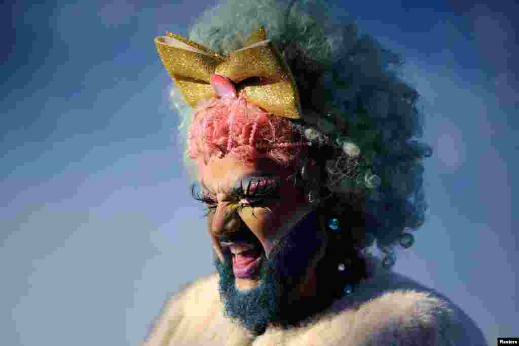 A reveler takes part in the "Free Parade" during LGBTIQ Pride Month in Porto Alegre, state of Rio Grande do Sul, Brazil, June 12, 2022.