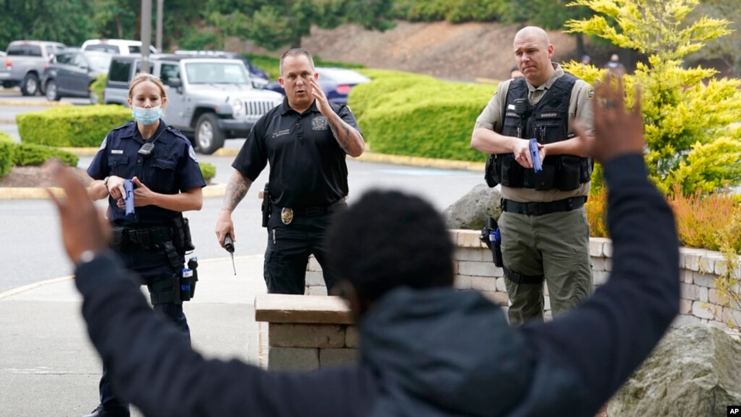 American police officers wearing body cameras as part of accountability reforms to protect civil liberties